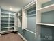 Spacious walk-in closet with ample shelving and hanging space at 122 Arrowood Ln, Harmony, NC 28634