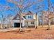 Two-story house with attached garage and front porch at 122 Arrowood Ln, Harmony, NC 28634