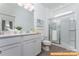 Clean bathroom with a walk-in shower and double vanity at 6316 Honor Ave, Midland, NC 28107