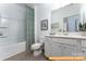 Simple bathroom with a bathtub and white vanity at 6316 Honor Ave, Midland, NC 28107