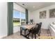 Small dining area with wooden table and chairs near a window at 6316 Honor Ave, Midland, NC 28107