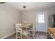 Dining area with a small table and three chairs near a back door at 1723 Sunnybrook Dr, Rock Hill, SC 29730