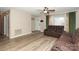 Living room with two brown leather recliners and wood-look floors at 1723 Sunnybrook Dr, Rock Hill, SC 29730