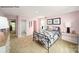 Charming bedroom with pink walls and a metal bed frame at 189 Giant Oak Ave, Statesville, NC 28677