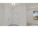 Bright entryway with white walls, light wood floors, and a coat closet at 2005 Near Point Rd # 22, Charlotte, NC 28208