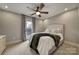 Bedroom with queen bed, ceiling fan and access to balcony at 2219 Aria Park Dr, Charlotte, NC 28262