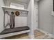 Functional entryway with built-in bench and shelving at 2219 Aria Park Dr, Charlotte, NC 28262