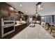 Modern kitchen with white countertops and dark brown cabinets at 2219 Aria Park Dr, Charlotte, NC 28262