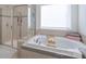 Bathroom featuring a large garden tub and separate shower at 442 Hunton Forest Nw Dr, Concord, NC 28027