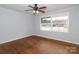 Bright bedroom with hardwood floors and a large window at 4658 Murrayhill Rd, Charlotte, NC 28209