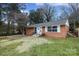 Brick ranch house with a landscaped yard at 4658 Murrayhill Rd, Charlotte, NC 28209