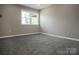 Simple bedroom with grey carpet and neutral walls at 623 Oak Grove Rd, Kings Mountain, NC 28086