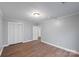 Bedroom with hardwood floors and access to another room at 634 Colston St, Albemarle, NC 28001