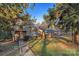 Charming ranch house with a walkway and mature trees at 634 Colston St, Albemarle, NC 28001