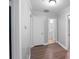 Clean hallway with wood-look floors and access to bathroom at 634 Colston St, Albemarle, NC 28001
