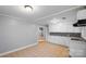 Renovated kitchen with white cabinets and tile backsplash at 634 Colston St, Albemarle, NC 28001