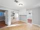 View of kitchen from dining area, white cabinets, and tile floors at 634 Colston St, Albemarle, NC 28001