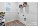 Laundry room with wire shelving, providing ample storage space at 7112 Wayfarer Dr # 0081, Charlotte, NC 28269