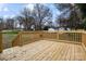 New wooden deck overlooks the backyard at 840 Belmorrow Dr, Charlotte, NC 28214