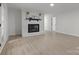 Bright living room with fireplace and hardwood floors at 840 Belmorrow Dr, Charlotte, NC 28214