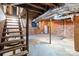 Unfinished basement with brick walls and stairs at 945 Potneck Rd, Salisbury, NC 28147