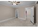 Spacious bedroom with carpet, ceiling fan and access to hallway at 945 Potneck Rd, Salisbury, NC 28147