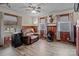 Living room with hardwood floors, comfy seating, and wood paneled walls at 945 Potneck Rd, Salisbury, NC 28147