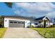 Stylish modern farmhouse with a gray garage and welcoming front porch, nestled on a grassy lot at 117 Spring Run Dr, Mooresville, NC 28117