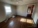 Simple bedroom with wood floors and a window at 1211 N Boyce St, Gastonia, NC 28052