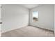 Well-lit bedroom with neutral walls and carpeted floors at 1742 Blanche St, Charlotte, NC 28262