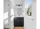 Simple bathroom with dark vanity and window at 211 Chestnut St, Shelby, NC 28150