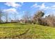 Spacious backyard with grassy area and mature trees at 3100 Nc Hwy 18 Hwy, Vale, NC 28168