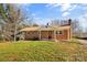 Brick ranch house with a covered porch and a spacious lawn at 3100 Nc Hwy 18 Hwy, Vale, NC 28168