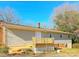 Tan house exterior with a deck and landscaping at 3100 Nc Hwy 18 Hwy, Vale, NC 28168