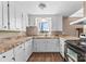 L-shaped kitchen with white cabinets and granite countertops at 3100 Nc Hwy 18 Hwy, Vale, NC 28168