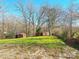 Rustic property with three small outbuildings and a grassy area at 3100 Nc Hwy 18 Hwy, Vale, NC 28168