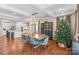 Bright dining area with a large table and hardwood floors at 4171 Island Fox Ln, Denver, NC 28037