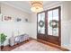 Bright and airy entryway with a bench, decorative pillows, and hardwood floors at 4171 Island Fox Ln, Denver, NC 28037