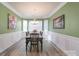 Formal dining room with hardwood floors, chandelier, and green walls at 4316 Falls Lake Dr, Concord, NC 28025