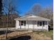 House exterior showcasing a metal roof and a simple design at 510 Cannon St, Rockwell, NC 28138