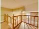 Upstairs hallway with wooden railing overlooking the living room at 523 Fox Ave, Chester, SC 29706