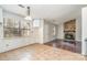 Kitchen features stone fireplace and hardwood floors at 616 Cricketwood Ln, Charlotte, NC 28215