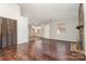 Living room with hardwood floors and stone fireplace at 616 Cricketwood Ln, Charlotte, NC 28215