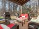 Relaxing backyard patio with firepit, seating area, and wooded backdrop at 7004 Mclothian Ln, Huntersville, NC 28078