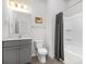 Clean bathroom with a shower/tub combo and gray vanity at 840 Imperial Ct, Charlotte, NC 28273