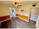 Dining area with hardwood floors and orange accent wall at 8717 Windsong Dr, Charlotte, NC 28273