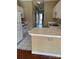 Kitchen with white cabinets, a breakfast bar, and access to the back at 9135 Meadow Vista Rd, Charlotte, NC 28213