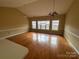 Spacious living room with hardwood floors and a vaulted ceiling at 9135 Meadow Vista Rd, Charlotte, NC 28213