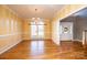 Bright dining room featuring hardwood floors, large window, and decorative chandelier at 1107 Fox Chase Dr, Newton, NC 28658