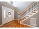 Bright and spacious entryway with hardwood floors and elegant staircase at 1107 Fox Chase Dr, Newton, NC 28658